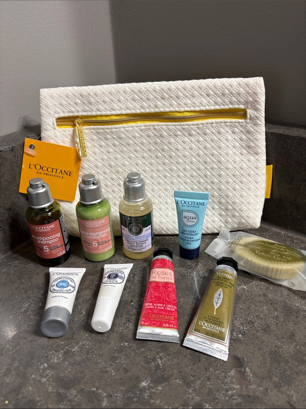 L'OCCITANE White Pouch with Yellow Trim & Assorted Travel Skincare